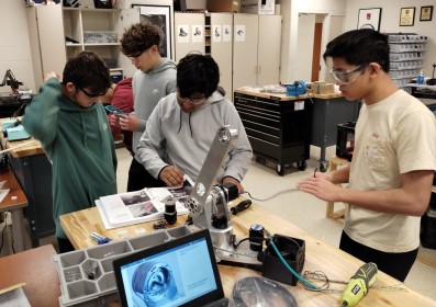 Students working on arm