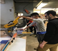 Students working with a circular saw.